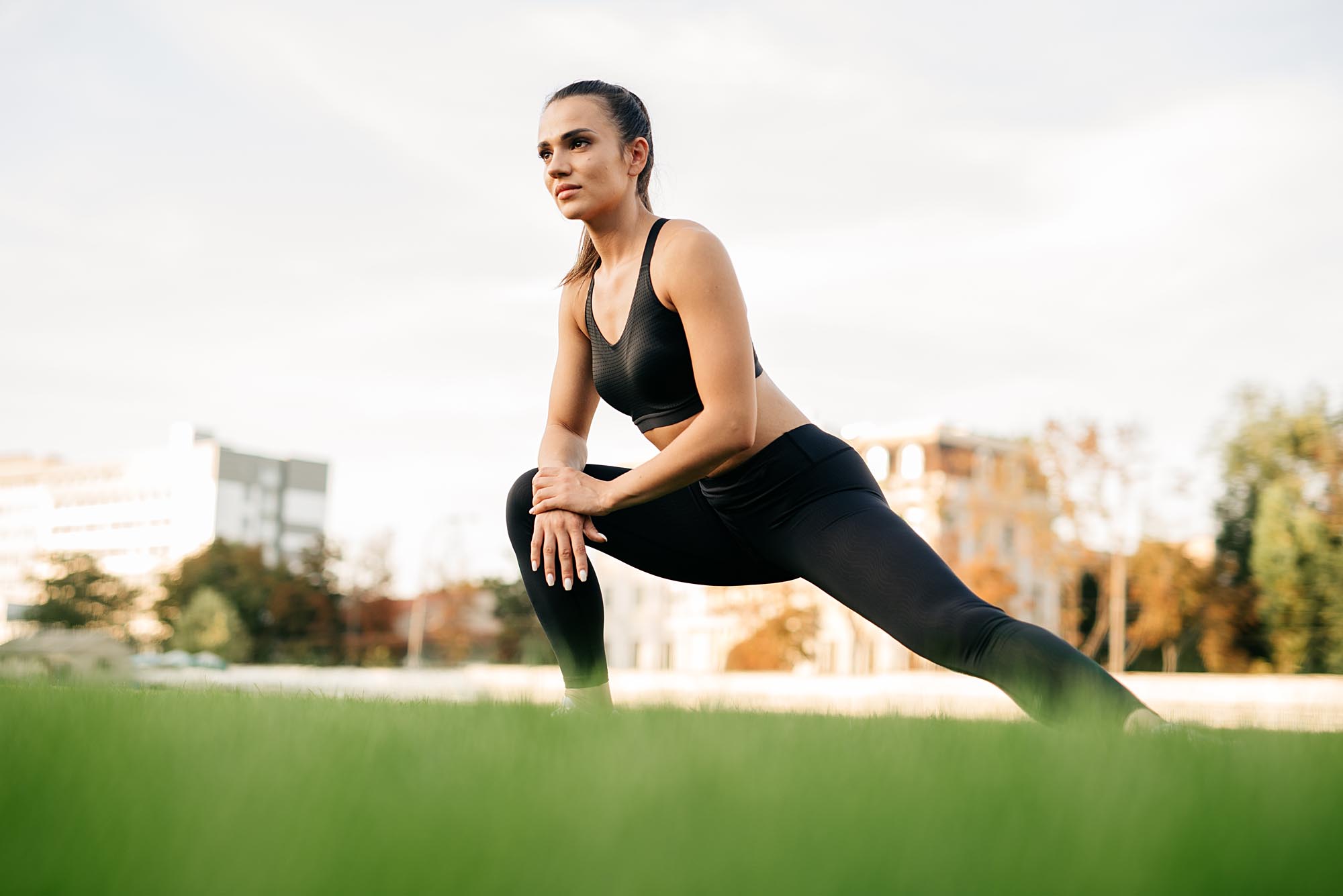 beautiful-sports-girl-is-engaged-sports-stadium-warm-up-muscles-before-training